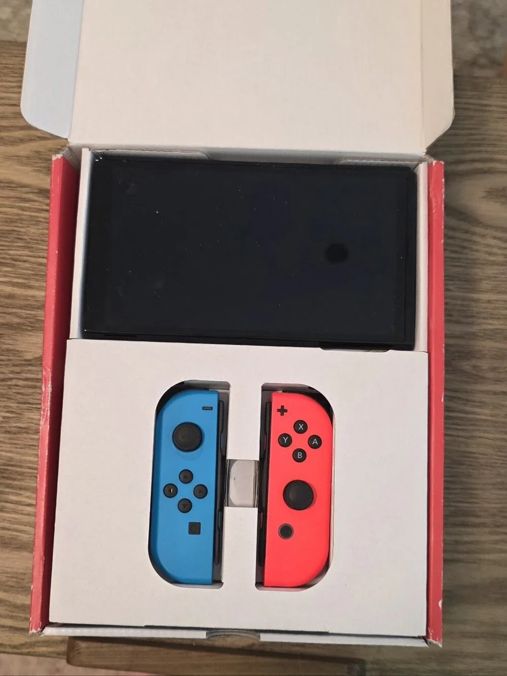 Nintendo Switch OLED - Neon Blue/Neon Red Renewed